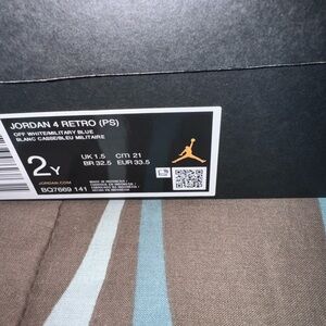Never worn. Blue/white Jordan 4 size 2